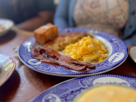 Eggs, bacon, hash browns and the French toast stick