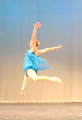 Dancer on stage at performance.