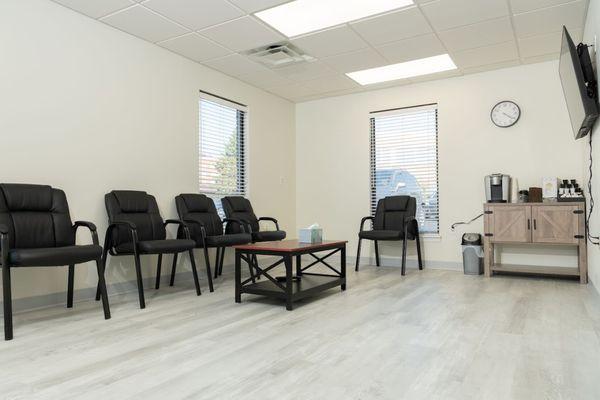 Comfortable seating with a TV complimentary coffee/water in our waiting room.