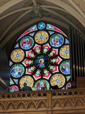 Rose window featuring St. Cecelia, patron saint of musicians