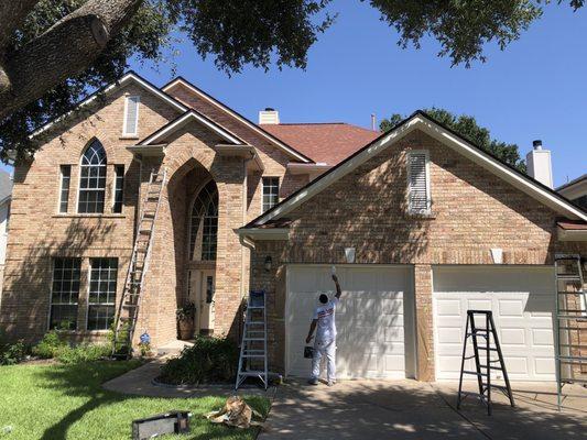 Almost finished. The front door wasn't yet painted, so you can see the difference. It's Shoji White. Love the new look.