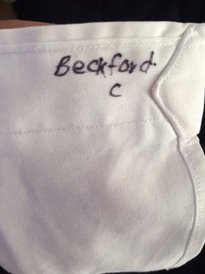 why would you write on my all-white clothing? what kind of dry cleaners does this?