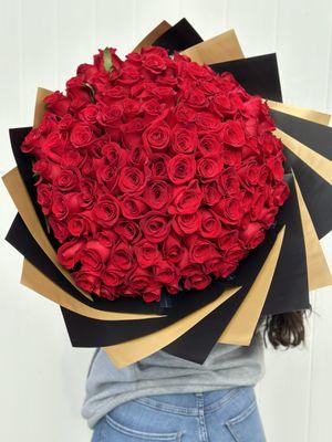 A beautiful arrangement of 120 wrapped red roses, perfect for that special person.