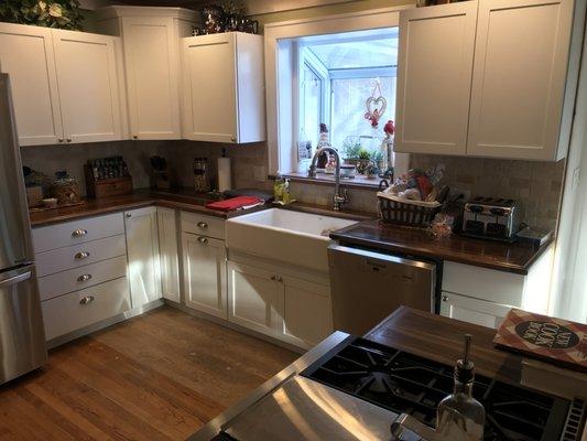 New Kitchen with Tumballed Travatine marble back splash and Black Walnut Top