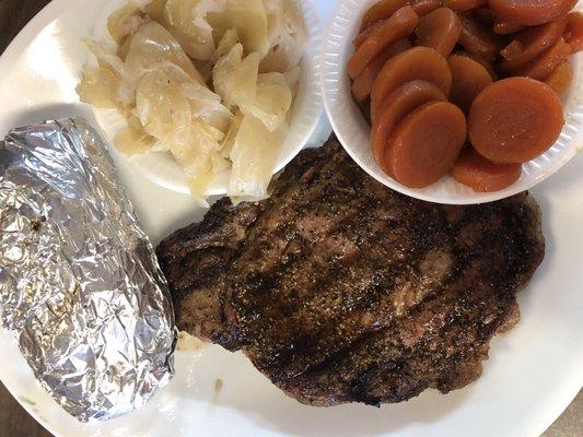 12oz Ribeye Steak, baked potato, carrots & cabbage.