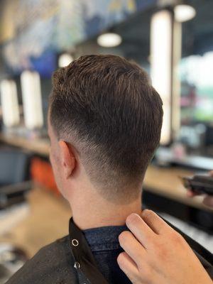 Fade haircut with razor finish by barber Sonia