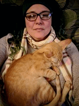 Me and one of my kitties snuggled up on a cold day.