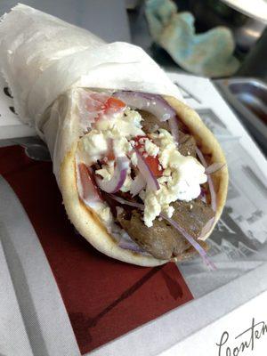 GYRO
made with :
Tzatziki sauce 
Tomato 
Red onion 
Feta cheese 
And beef/lamb Halal meat