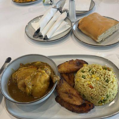 Curried chicken, fried plaintains, nigerian fried rice and beef patties.