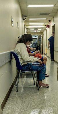 Separate uncomfortable X Ray waiting room in hallway outside X-ray room. Wait takes 45 minutes in these chairs.