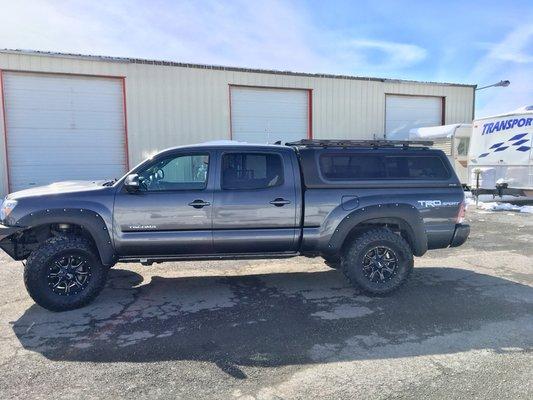 Here is another Overland Shell on a Tacoma, with an aftermarket cap rack