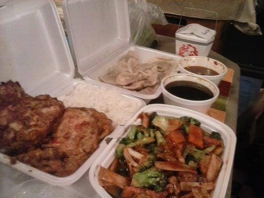 Roast pork egg foo young and sauce with white rice, Hunan chicken with white rice, and 8 steamed dumplings with dip.