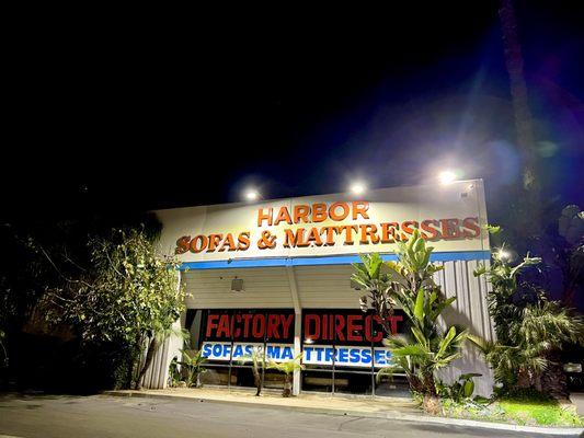 A photo of our shop at night, we keep the lights on!