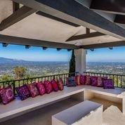 Home with a view! This outside sitting area welcomes the guests to come and enjoy the views