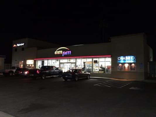 Arco AM/PM mini-mart at night, with Pizza Hut next door