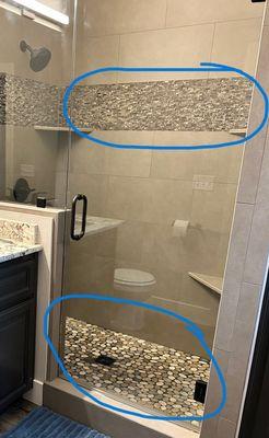 Completed shower with incorrected pebbles in the pan.  Should be the same tones as the accent tile on top.