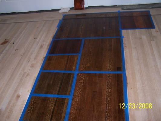 Applying color samples to the choice of client on his/her own floor.