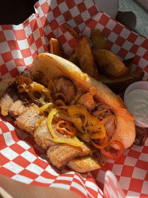 Pork belly sandwich with potato wedges