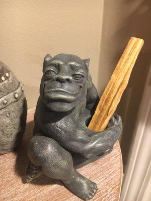 Super sweet gargoyle, he's holding my palo santo stick now