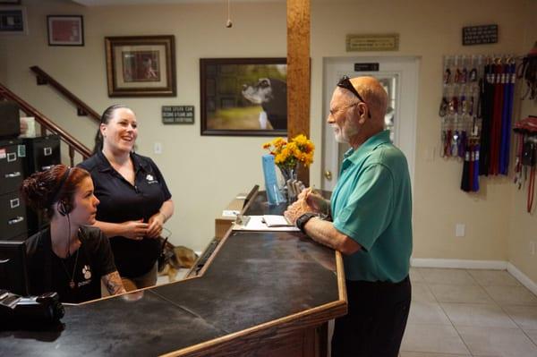 Friendly and helpful staff talking with customer