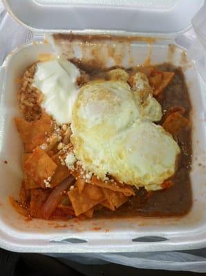 Chilaques rojos, beans, rice, eggs, sour cream, cheese.