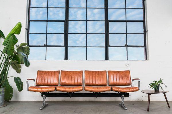 We've updated the Chromcraft airport bench, which lived in PDX for over 30 years, with high quality leather and solid wood.