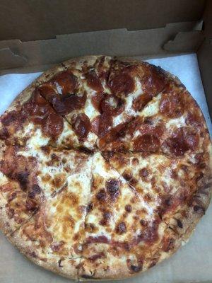 Half cheese half pepperoni pizza with light sauce.