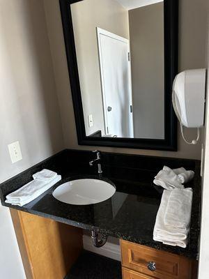 Seperate sink area to get ready if someone is in the bathroom!