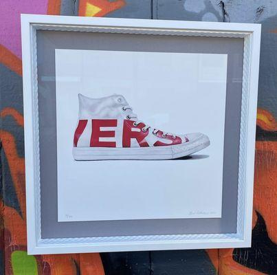 Floating set of Converse prints in a white on white stack with a sidewinder frame as a liner to pick up the rubber sole (and museum glass!)