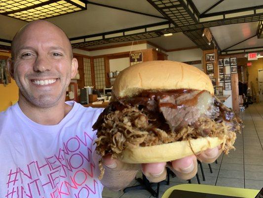 I'm enjoying and epic Pulled pork sandwich topped with smoked brisket