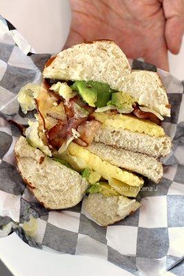 Inside of Bacon, Avocado, Egg & Cheese ($6.75) - Applewood Smoked Bacon, Avocado, Scrambled Egg Patty and Swiss Cheese on Pretzel Roll