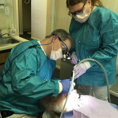 Dr. Jeff Matilsky with his wife, Debbie, helping a patient