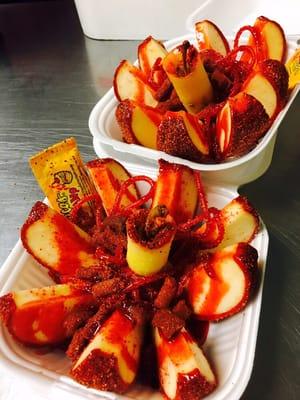 Crazy apple- covered in tamarind and chile powder opened and prepared with chamoy and tamarind candies!