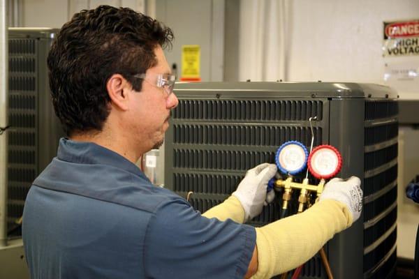 The Houston TX Plant checking the Charge of new AC condensers