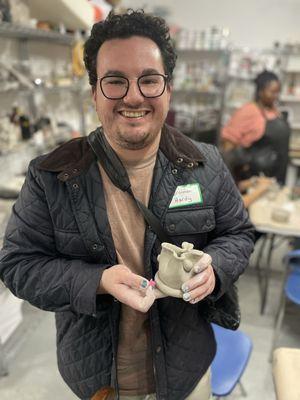 Student with his pottery