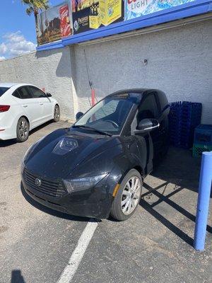 What a cool electric car plugged in out front!