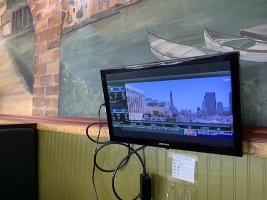 Nice little monitors at each booth . . . "Dude, can you turn down your volume?  I'm trying to watch Sports Center"