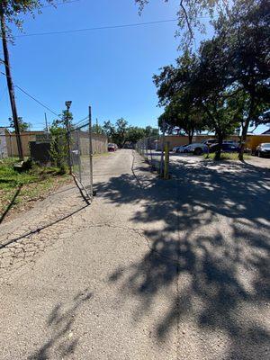 Gated fence storage unit