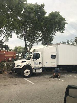 Free mechanic work at parking lot.