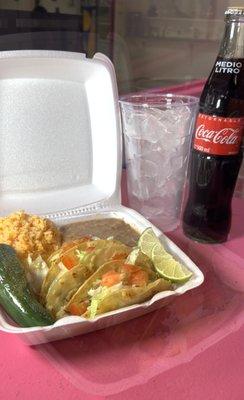 3 small quesadillas on corn in a plate with rice and refried beans.