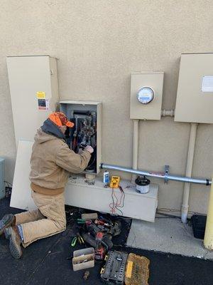 Kevin making conductor terminations at the electrical meter.