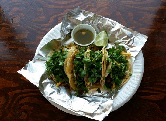 2 chorizo and 2 carne asada tacos with cilantro, cheese, lime, and salsa