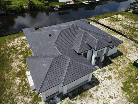 Completed new tile roof installation on a new construction home by Florida New Roof Company.