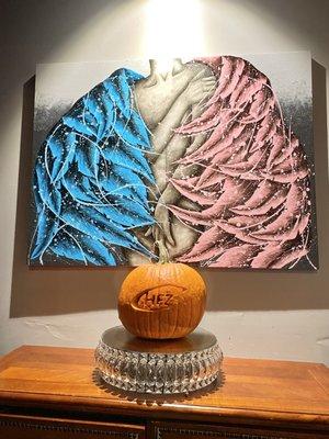 A permanent art installation at the chez, with a hand carved pumpkin made by a customer