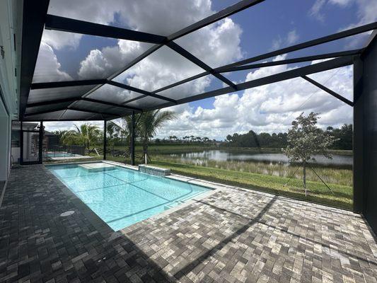 Pool enclosure over 55 feet across.