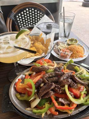 Million dollar margarita, steak fajitas meal.