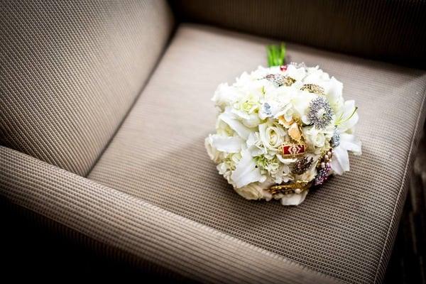 How Debbies incorporated my family broaches into my wedding bouquet. I couldn't have been happier.