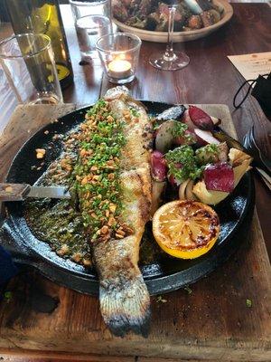 Whole roasted trout with charred radish on a cast iron plate - came out sizzling and delicious.