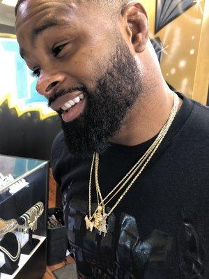 UFC WELTERWEIGHT CHAMP TYRON WOODLEY with his custom gold diamond chains and gold tooth