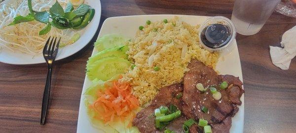 Fried rice with salad and pork chops